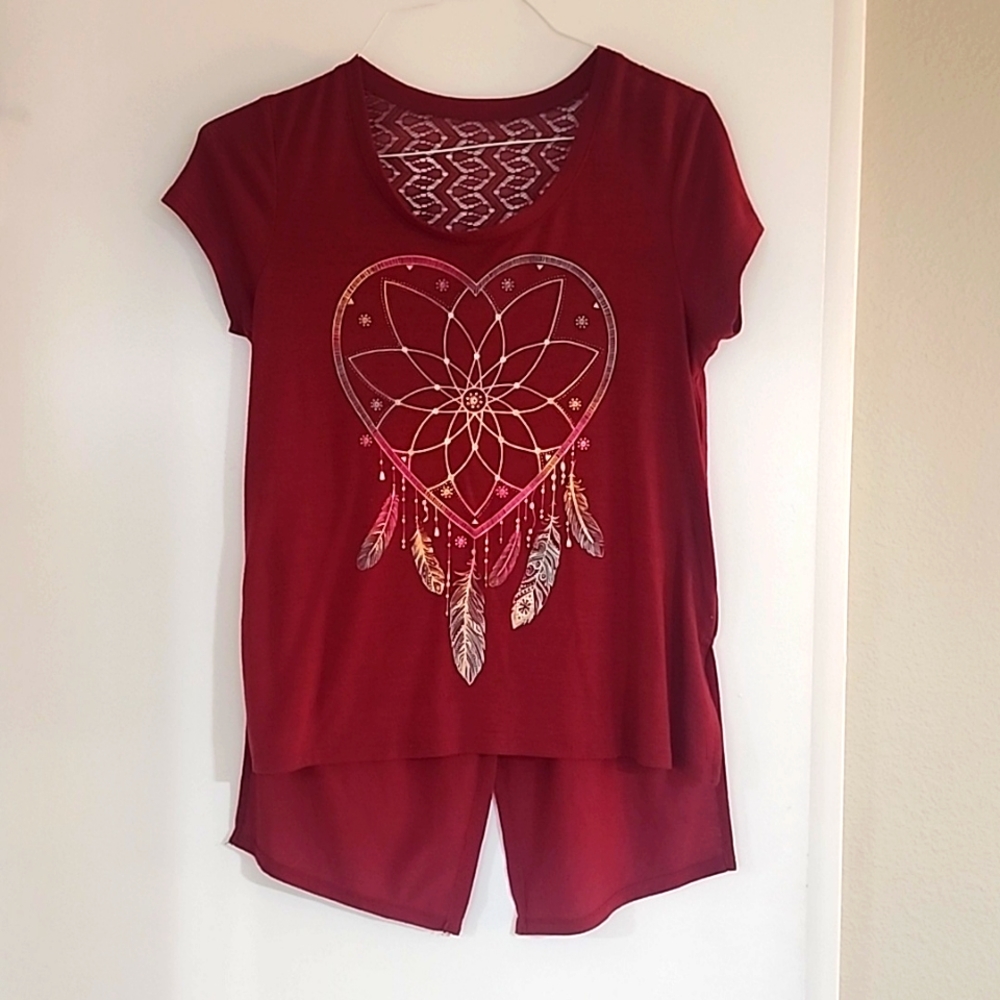Wine color No Boundaries shirt with lace detailing on the back.